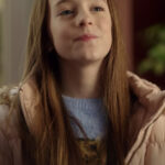 Annie Film My Christmas Guide 2023 Ava Weiss Pink Puffer Jacket.
